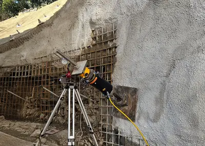 Following the dismantling of the historic masonry, the slope itself is stabilized using a shot-crete shell and anchors.
